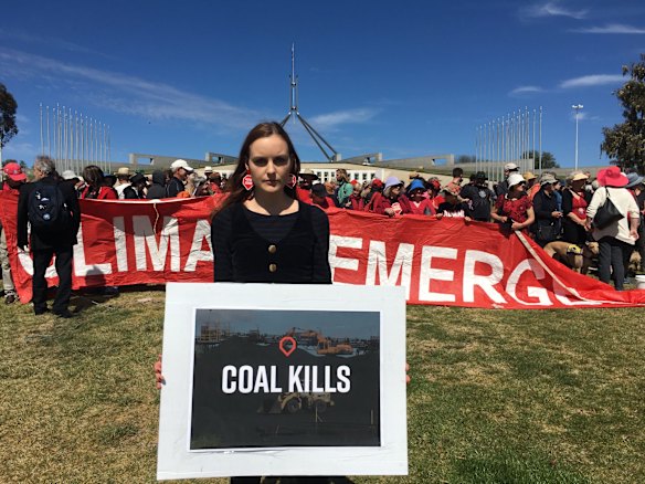Protesters against the proposed Adani coal mine gather on the lawn of Parliament House, Canberra.