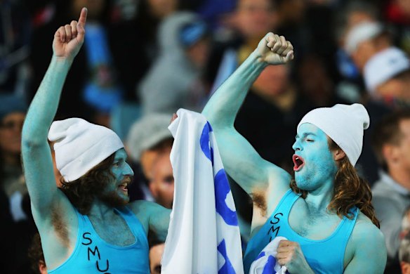 True blue: Waratahs fans cheer during the Super Rugby final against the Crusaders at ANZ Stadium.