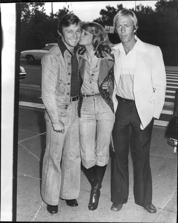 Paul Hogan, right, and his producer John Cornell arrived in Sydney after a five week "cultural exchange" tour of the US. In the States they taped a television special titled "Paul Hogan Pays Back Glen Campbell". The program starred Telly Savalas, The captain and Tenille and Rod Stewart. At Sydney Airport, Hogan and Cornell were met by Delvene Delaney who co-starred in the Special. November 16, 1976.
