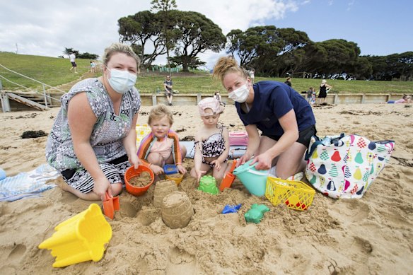 Dana Ellis from Belmont with her child Reggie, 2, and Sarah Jane Ross from Mt Duneed with her child Milla, 2 at Torquay.