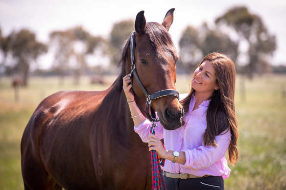 Nikki Cook, pictured with Grand Dreamer, has found new homes for about 300 ex-racehorses this year. 