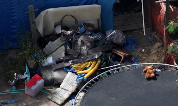 Children's toys sit amongst a debris pile in the backyard of alleged kidnapper Phillip Garrido in Antioch, California.