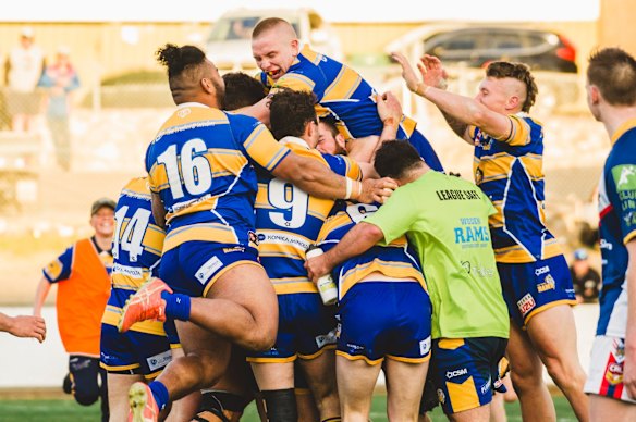 Woden Valley Rams celebrate their win.
