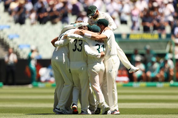 Australia celebrates after winning and retaining the Ashes after day three of the Third Test match in the Ashes series between Australia and England at Melbourne Cricket Ground.