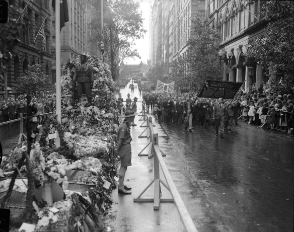 “Hushed crowds 10 and 12 deep at the wreath-decked Cenotaph in Martin Place saw the marchers salute those who did not return.”