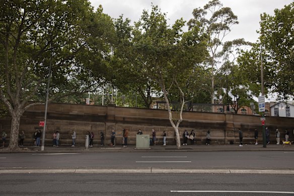 The line that snakes around Central Station for a COVID-19 PCR testing clinic in Sydney's CBD on Tuesday, December 28, 2021.