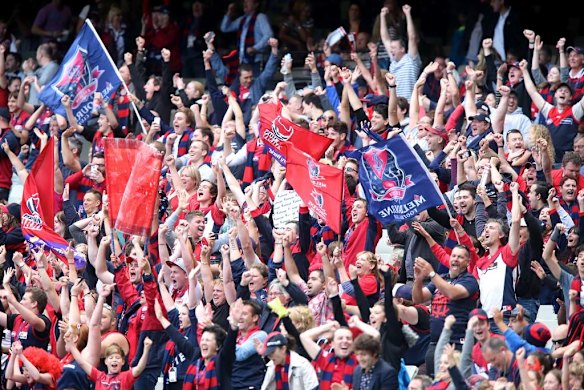 Melbourne fans celebrate their victory on the final siren.