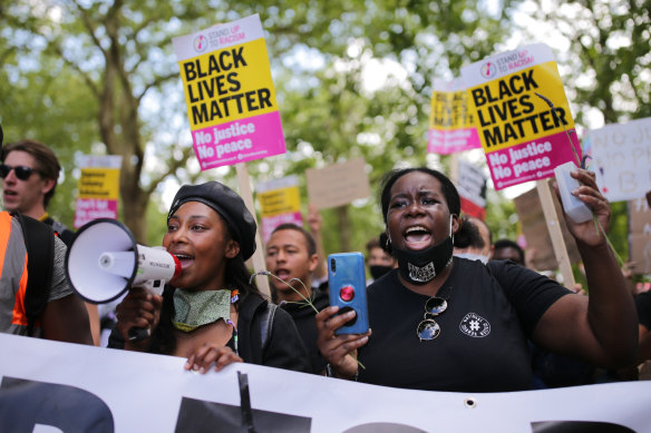Anti-racism protesters attend a Black Lives Matter rally in London.
