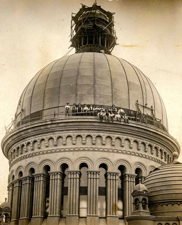 Construction workers sitting around dome of QVB, 1898.