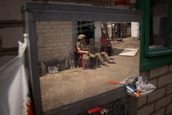 Members of the Ukrainian armed forces rest at a forward position in a front-line village in the Donetsk Region. Russia has stepped up its attacks in south-east Ukraine as it tries to advance further into Donetsk and Zaporizhzhia Oblasts.