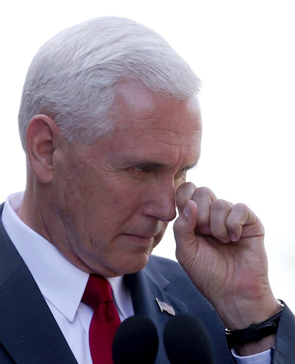 U.S. Vice President Mike Pence rubs his face during a joint press conference with Australian Prime Minister Malcolm Turnbull in Sydney.