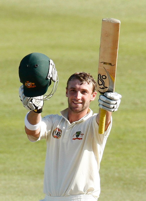 Australia's Phil Hughes celebrates his century during the third day of the second cricket test match against South Africa in Durban in this March 8, 2009