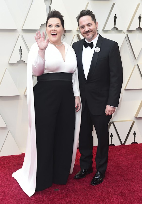 Melissa McCarthy, left, and Ben Falcone arrive at the Oscars, at the Dolby Theatre in Los Angeles.
