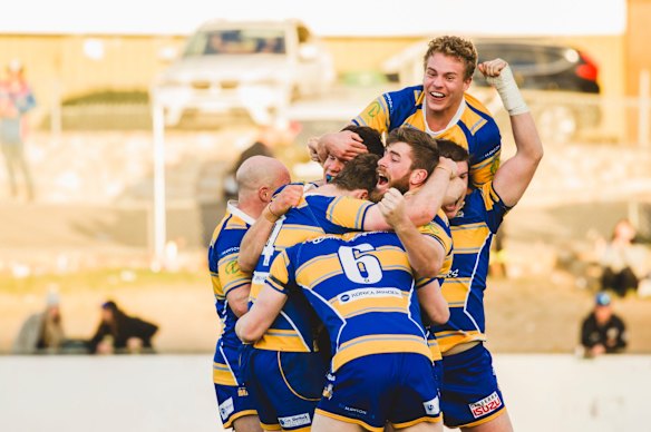 Woden Valley Rams celebrate their win.
