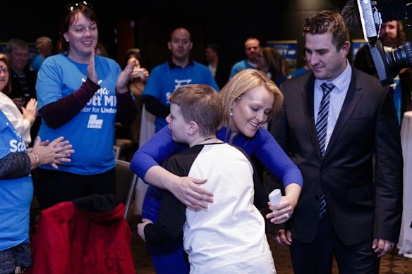 Lindsay MP Fiona Scott and husband Aaron arrive to greet supporters at the Penrith Leagues Club in Sydney, Australia. The result for Lindsay may go to postal votes, with the result on a knife edge.