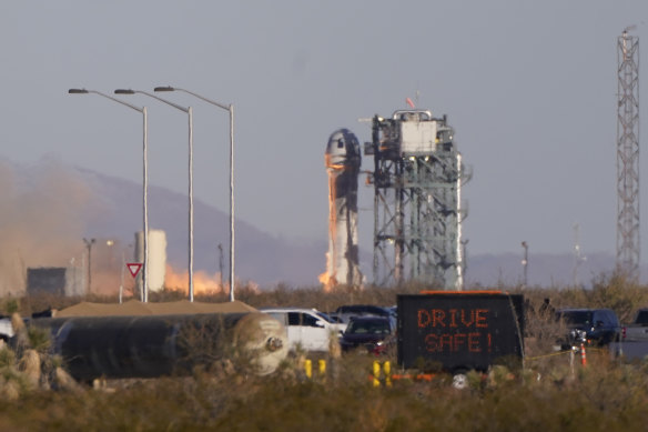 Blue Origin’s New Shepard rocket ignites during launch carrying a crew of six.