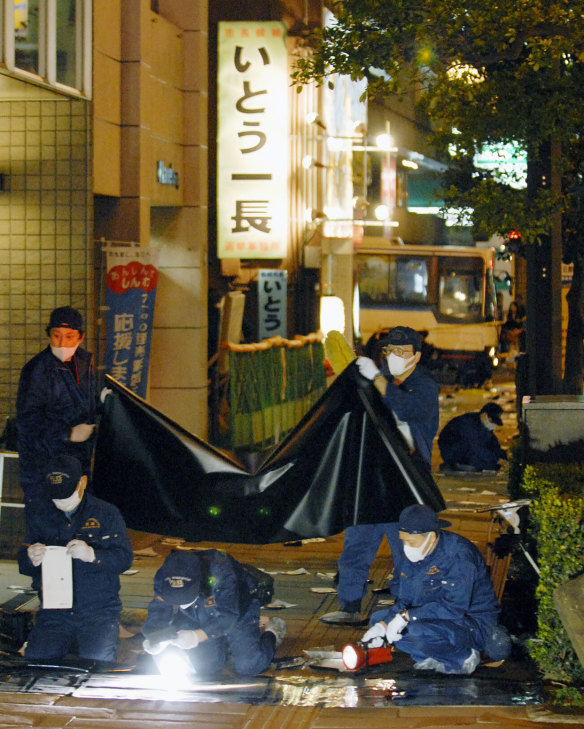 Police officers investigate the assassination of Nagasaki Mayor Iccho Ito in 2007, which is considered one of the key events that led to a crackdown on yakuza.