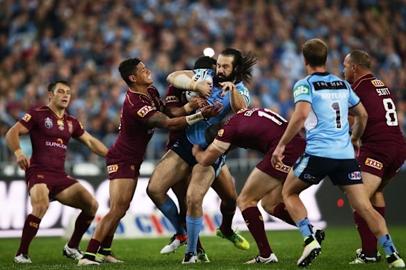 Aaron Woods of the Blues is tackled.