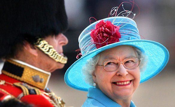 Britain's Queen Elizabeth II smiles at Prince Philip on Horse Guards Parade in London during the annual Trooping the Colour parade Saturday June 13, 2009. The Queen celebrates her official birthday Saturday with the Trooping the Colour parade involving more than 1,000 soldiers in the traditional display of pomp and pageantry. (AP Photo/Lewis Whyld/PA Wire) ** UNITED KINGDOM OUT NO SALES NO ARCHIVE **