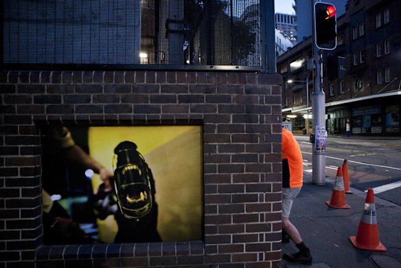 A group of Sydney based photographers have set up an impromptu photography exhibition along the walls of buildings on Elizabeth Street.