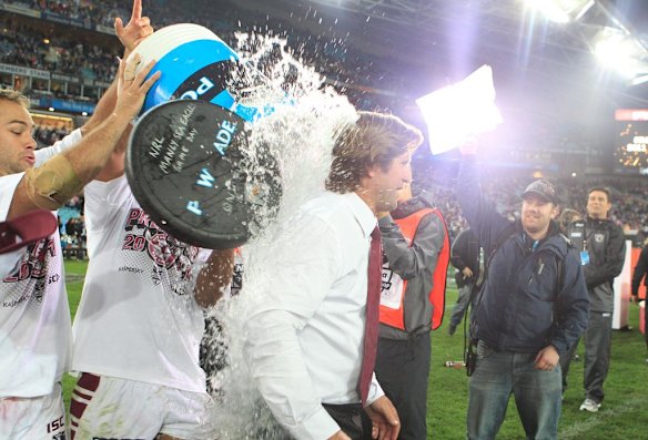 NRL Grand Final  2011 Manly Warringah Sea Eagles v  Warriors at ANZ Stadium, Coach Des Hasler is hit with a Powerade shower by Brett Stewart. Sunday October 2nd 2011.