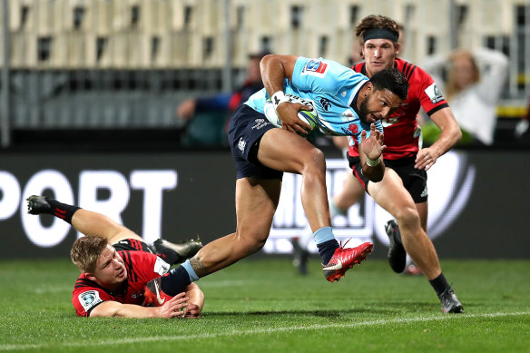 Breakthrough: Curtis Rona slips a Crusaders tackle.