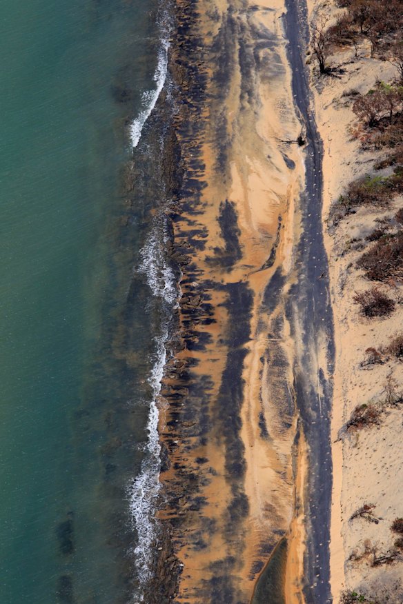 Abbott Point coal loading facility with coal water run off moving North West into the Wetlands. Coal dust on the Beaches next to the facility.