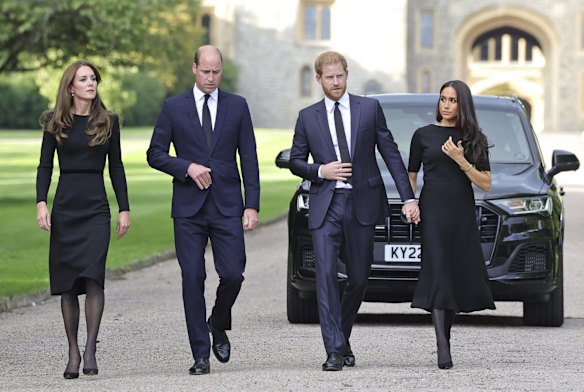 Catherine, The Princess of Wales; Prince William, Prince of Wales; Prince Harry, and Meghan, Duchess of Sussex walk to meet members of the public at Windsor Castle. 