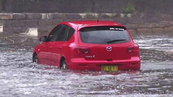 Cars stuck in flood water at Audrey Weir Royal National Park.