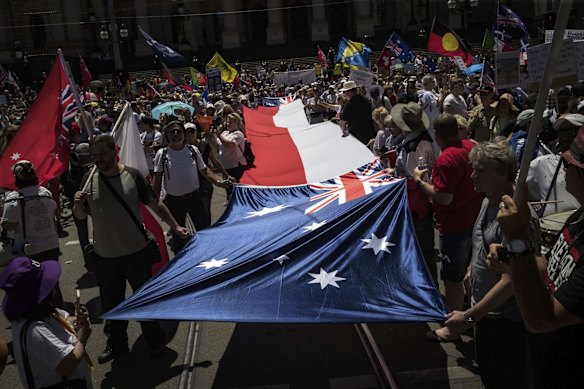 Protesters attend the Melbourne Freedom rally in the CBD