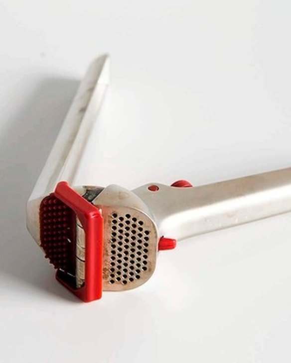 7 Manu's Dreamfarm garlic crusher deals with whole, unpeeled cloves.