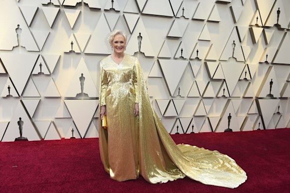 Nominee Glenn Close arrives dressed as an Oscar. She is wearing Carolina Herrera.