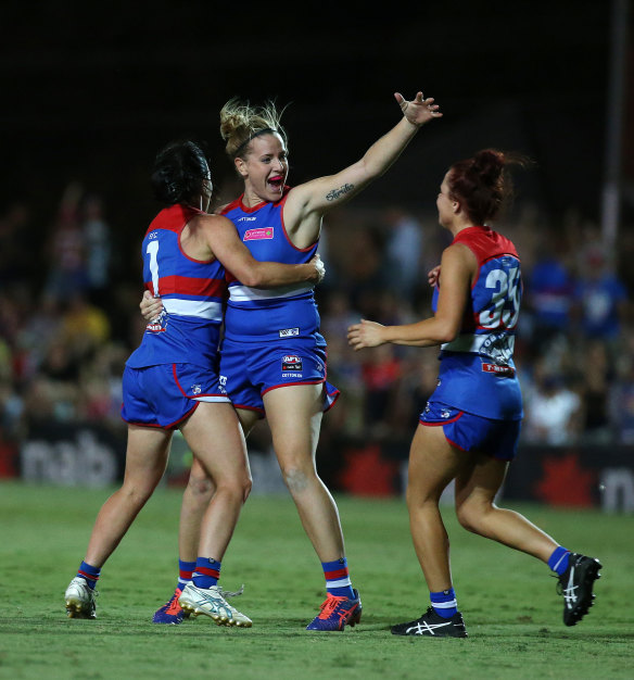 Bulldogs players celebrate the winning goal which put them into the AFLW grand final ahead of Melbourne. 