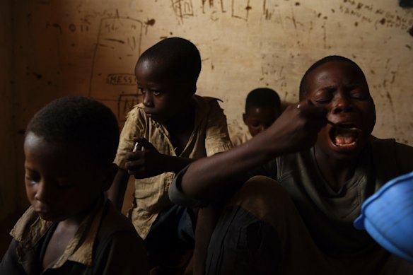 Children eat a meal at the World Vision sponsored child friendly space in Tshilumba village. International and local NGO's are fighting malnutrition.