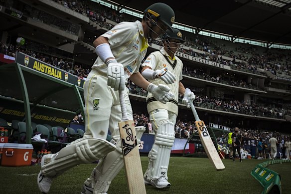 Marcus Harris and David Warner enter the field for Australia's first innings after England were all out for 185.