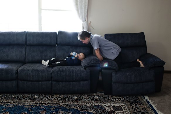 Arafat Tursun and Yusuf Muhammad playing at their home in Adelaide.