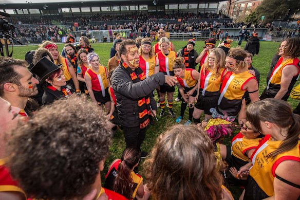 Rockdogs coach Grant Hansen addresses the players.
