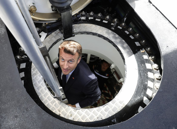 French President Emmanuel Macron inspects a new nuclear submarine at the Cherbourg shipyard in 2019. He was less than pleased with Australia’s backflip over the collaboration to build 12 subs.