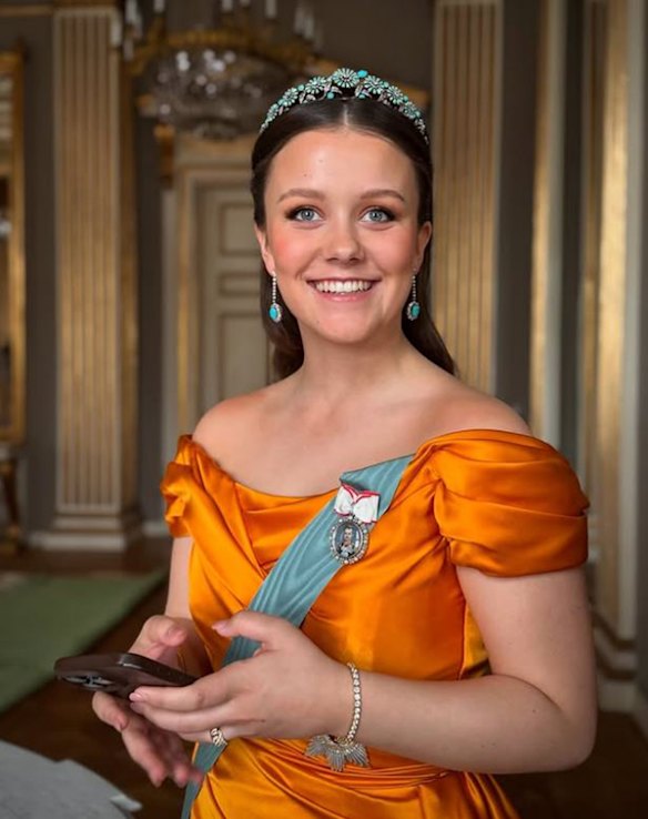 Danish Princess Isabella holds her phone in a portrait shared on the  royal family’s social media.