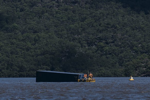 A Shipping Container grounded on a sandbar along the Hawkesbury River, east of Berowra Creek, after last week's torrential rain and flooding along the Hawkesbury river system.