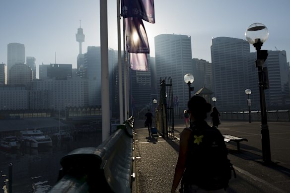 Workers heading into the CBD across the Pyrmont Bridge this morning.