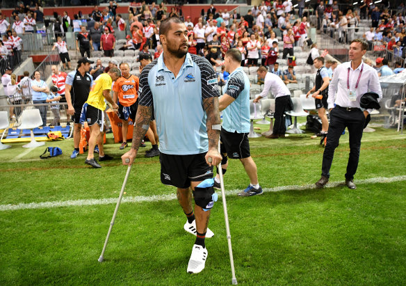 Injury blow: Andrew Fifita hobbles on the sidelines in Cronulla's loss to St George Illawarra.