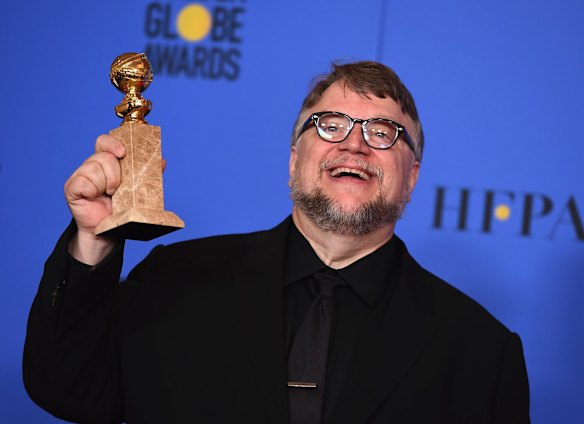 Guillermo del Toro with the award for best director (motion picture) for <i>The Shape of Water</i>.