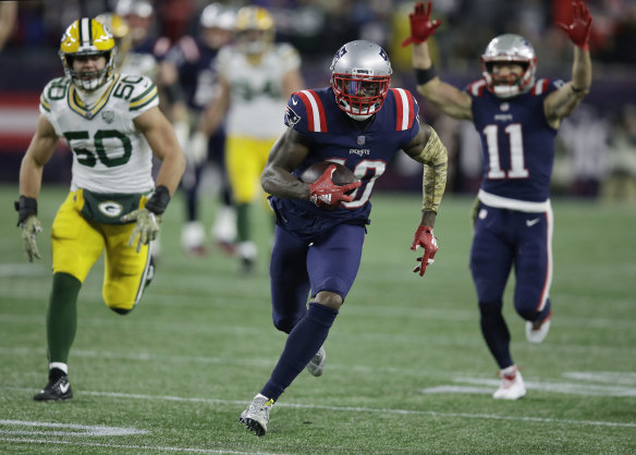 All over: Patriots wide receiver Josh Gordon streaks away to seal the win.