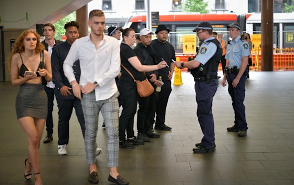 Police checking permits within the Green Zone at Circular Quay on New Years Eve. All of the Sydney Harbour foreshore has been locked down to prevent the further spread of COVID-19.