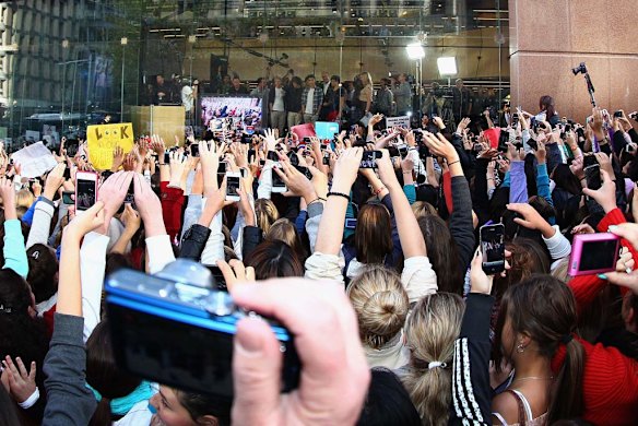 One Direction look out to fans during their visit to Sunrise Martin Place studio.