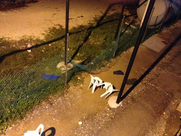 Manus Island scenes of where Asylum seekers are detained before and after recent riots. Rear fence looking down.