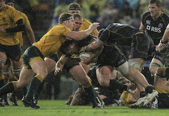 David Pocock tries to stop another Scottish pick up and drive.