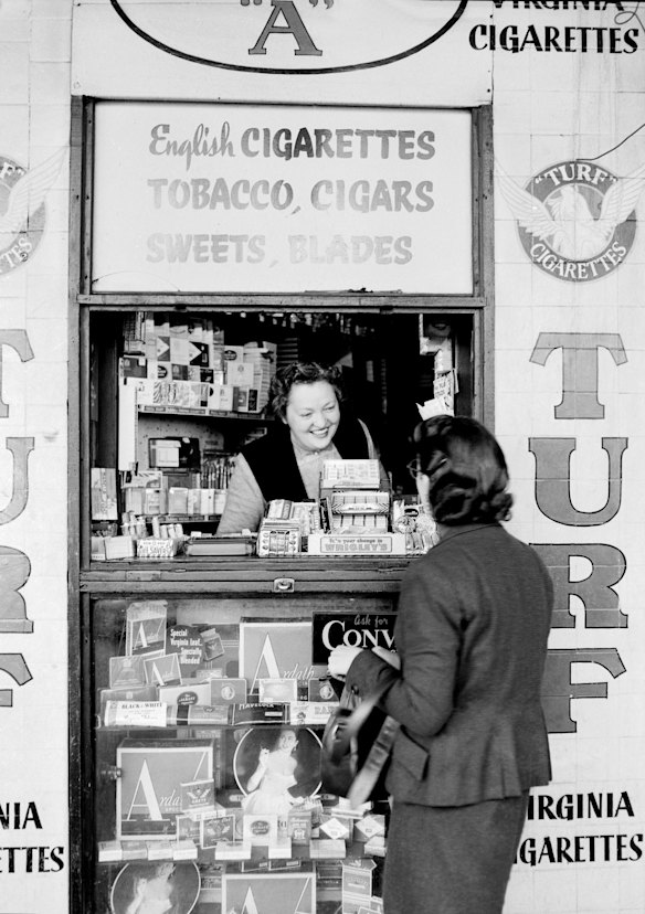 Miss J Stein works the Kings Cross Kiosk on the Mark Foys Patio in Sydney on 5th July 1956.