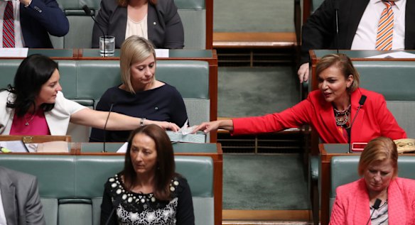 Emma Husar offers Anne Aly tissues during question time at Parliament House in Canberra on Wednesday 25 October 2017.
